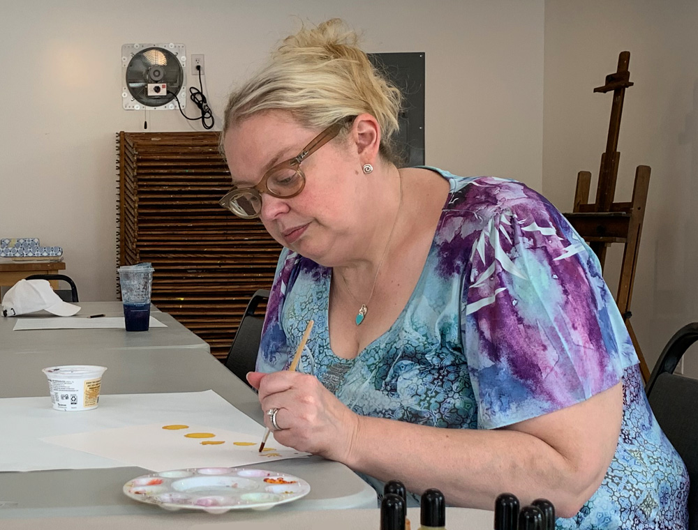 julie painting at chesterton art center